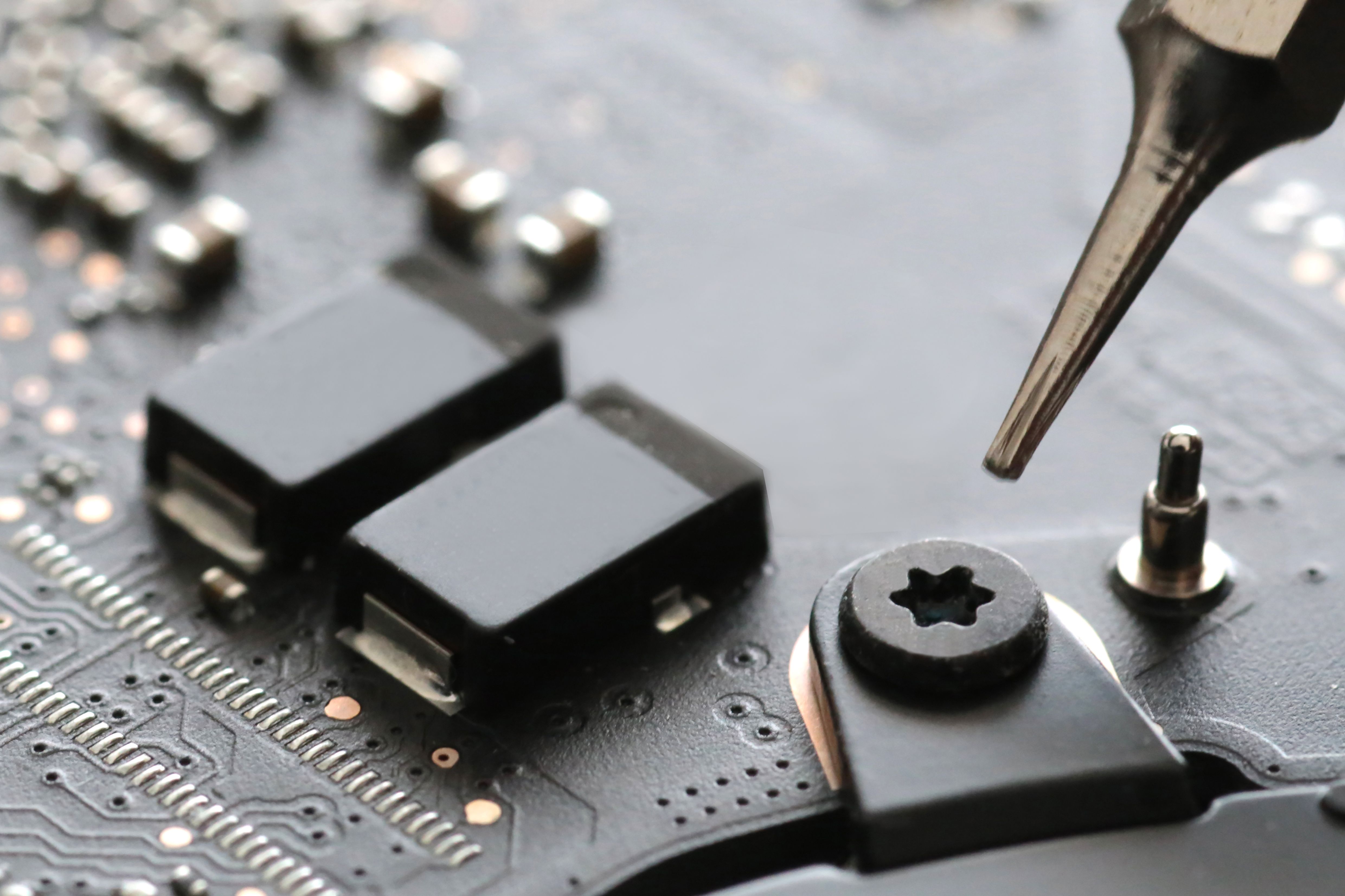 technician repairing smartphone