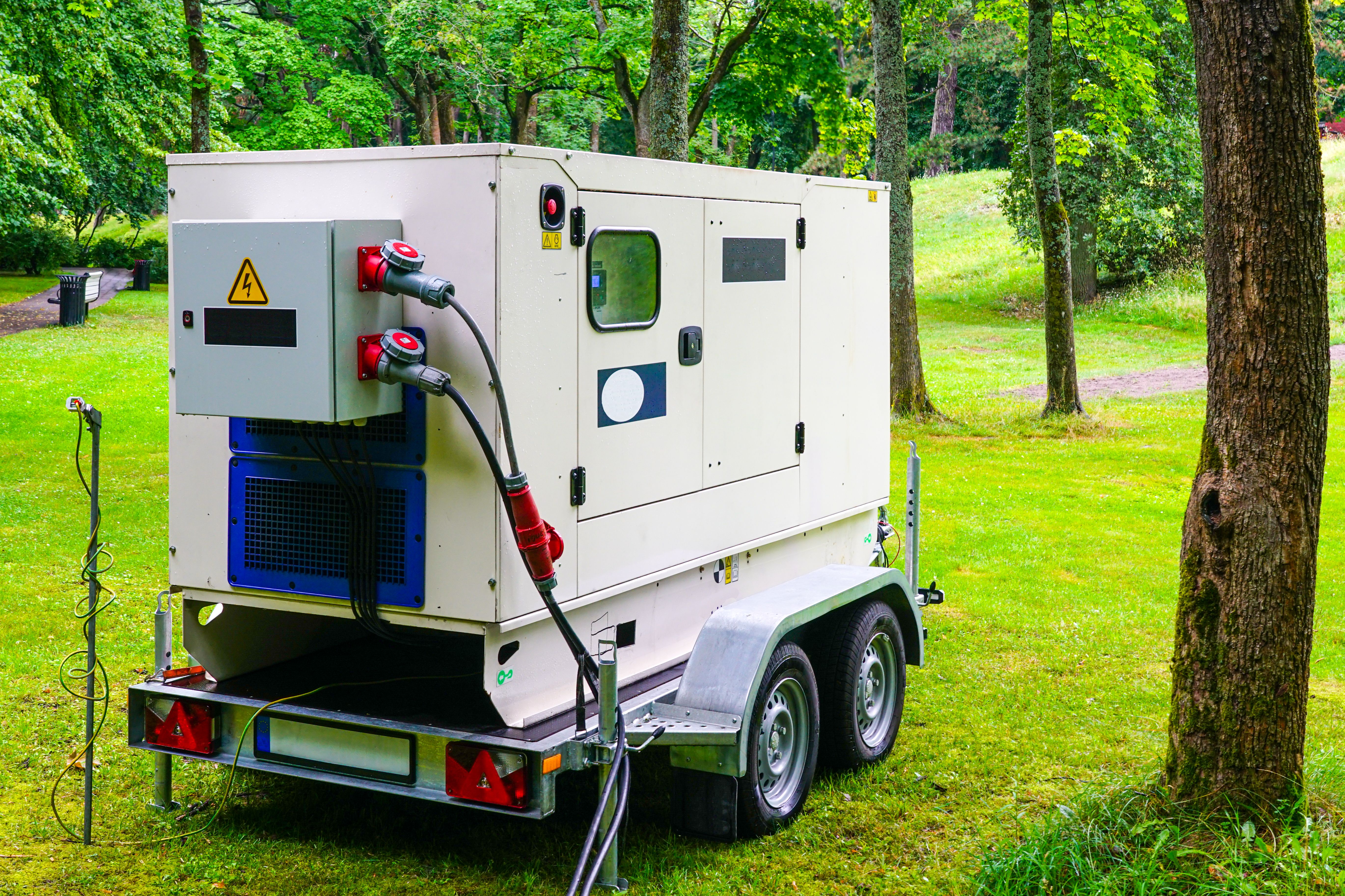 Connected large rental diesel generator on a mobile trailer for outdoor event power supply