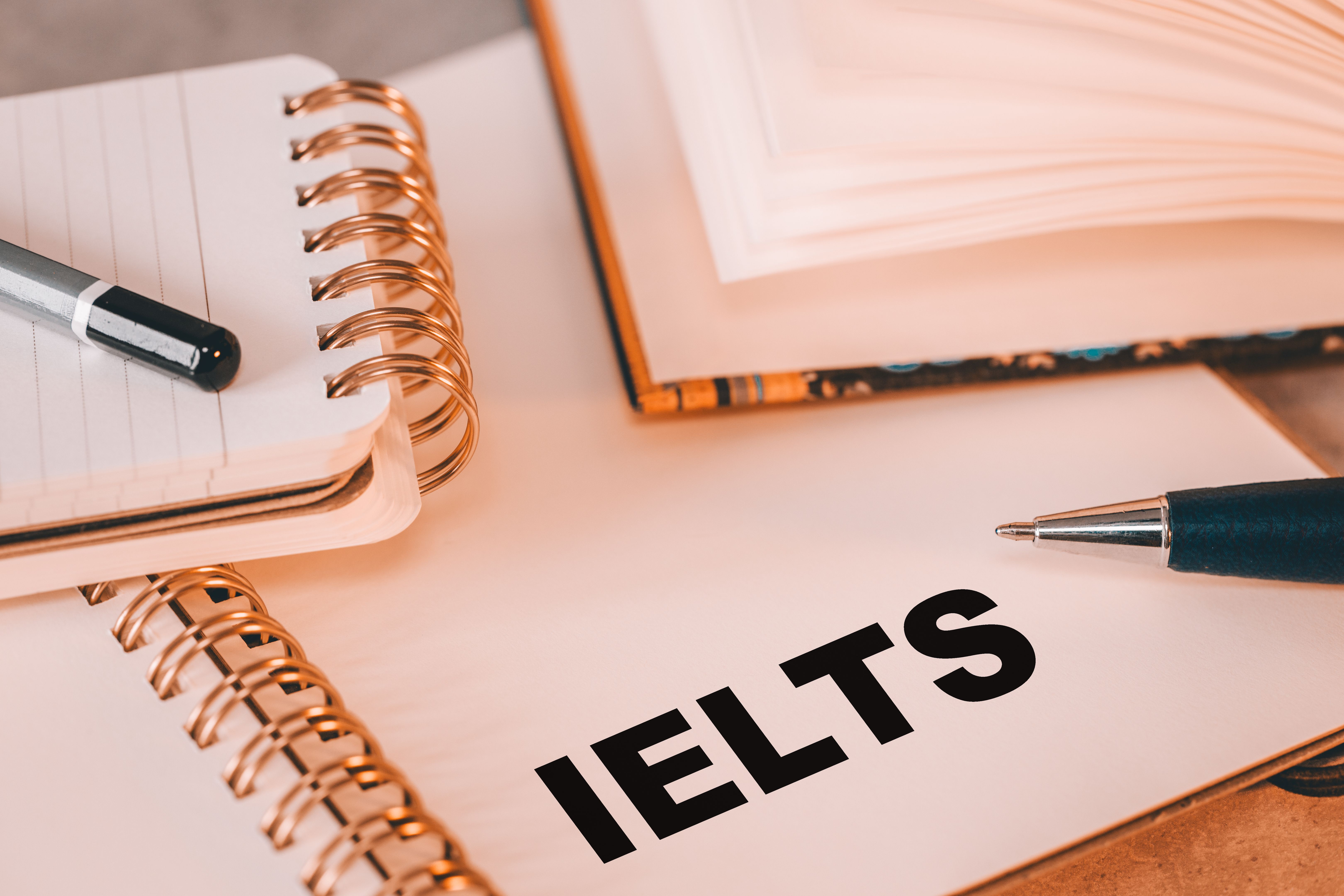 IELTS written in notebook (International English Language Testing System) Conceptual word, Education and international work