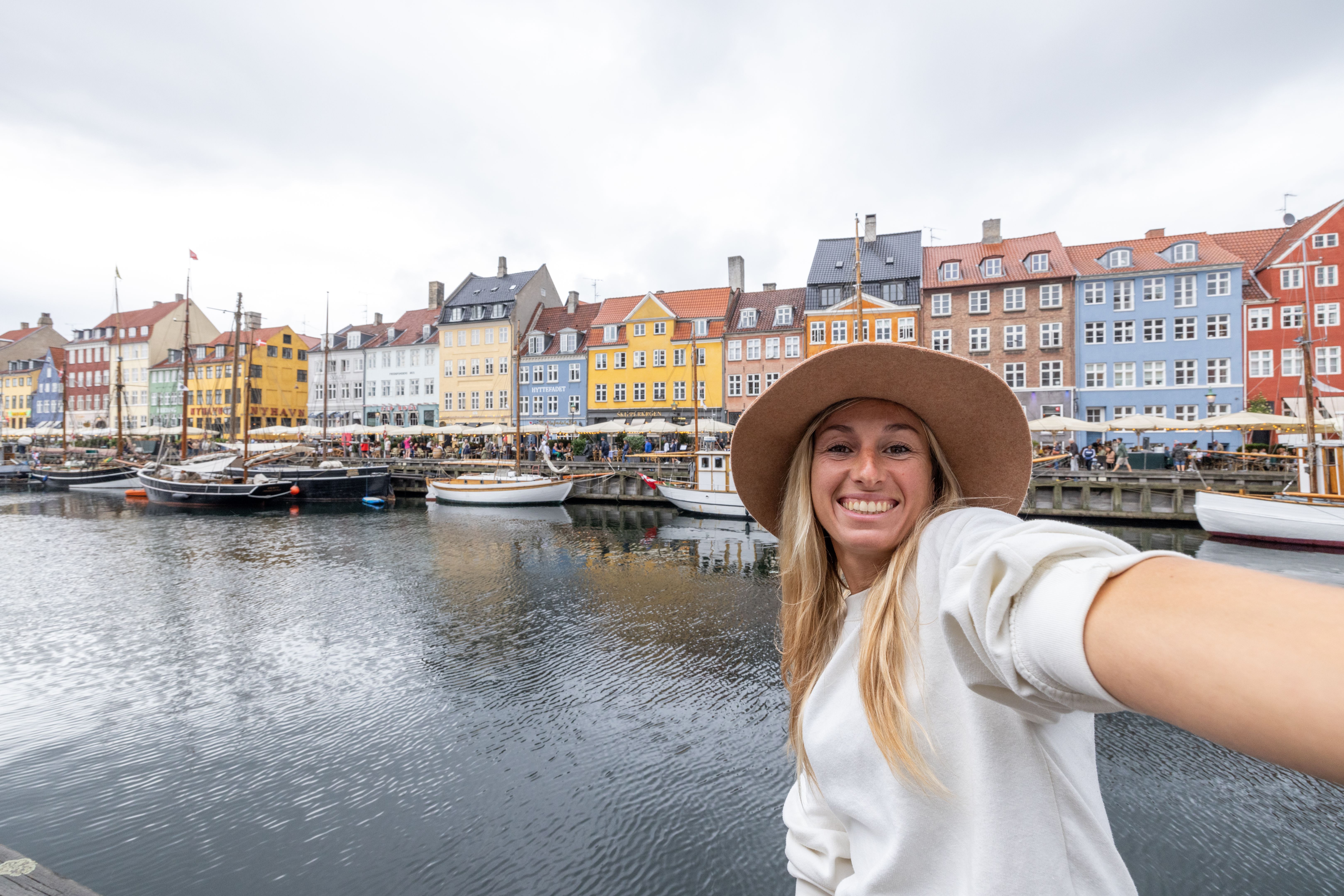 Joyful Tourist Taking a Selfie at Nyhavn Canal, Copenhagen
