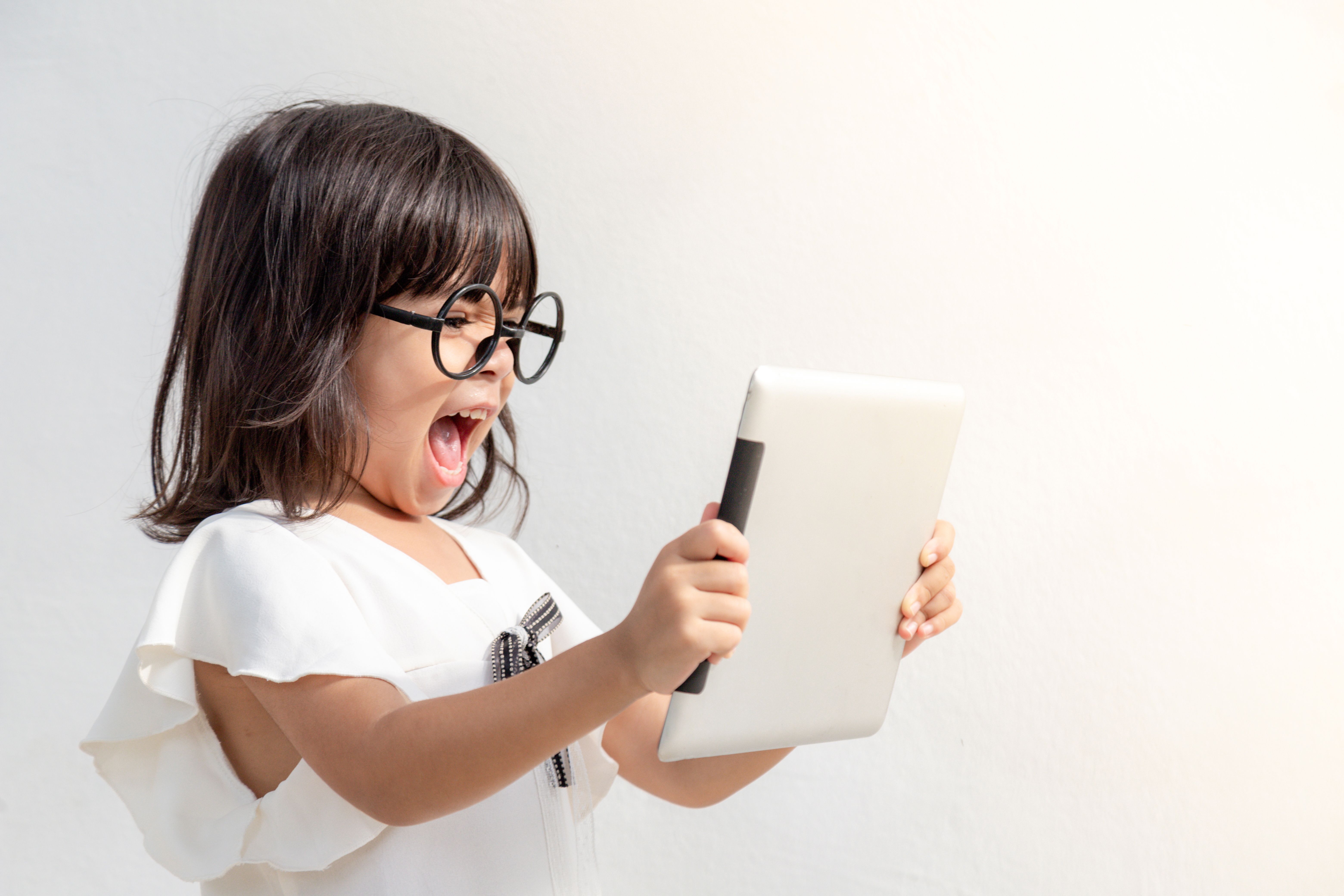 child using educational tablet