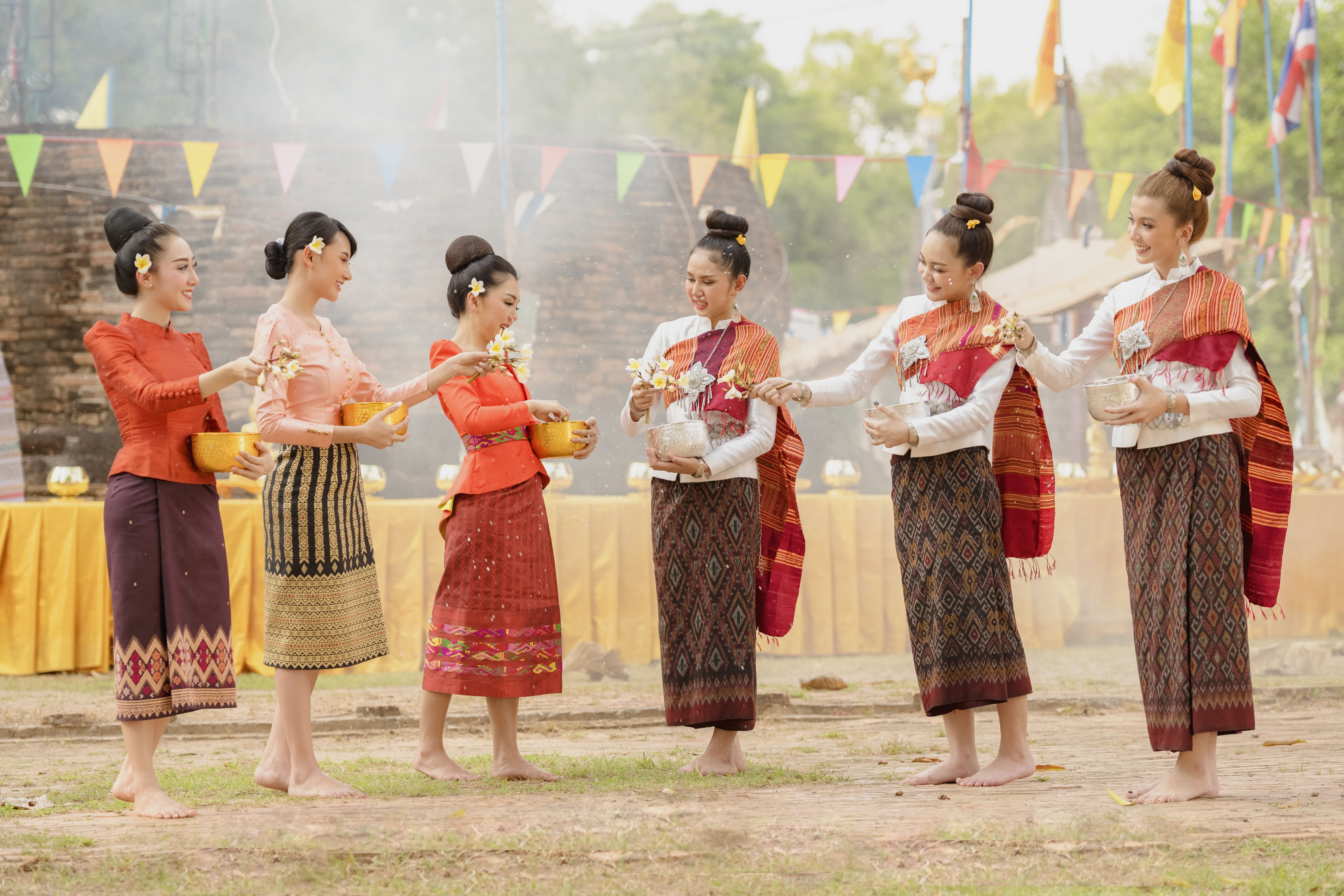Thai girls and laos girls splashing water during Songkran festival Thai girls and laos girls splashing water during Songkran festival