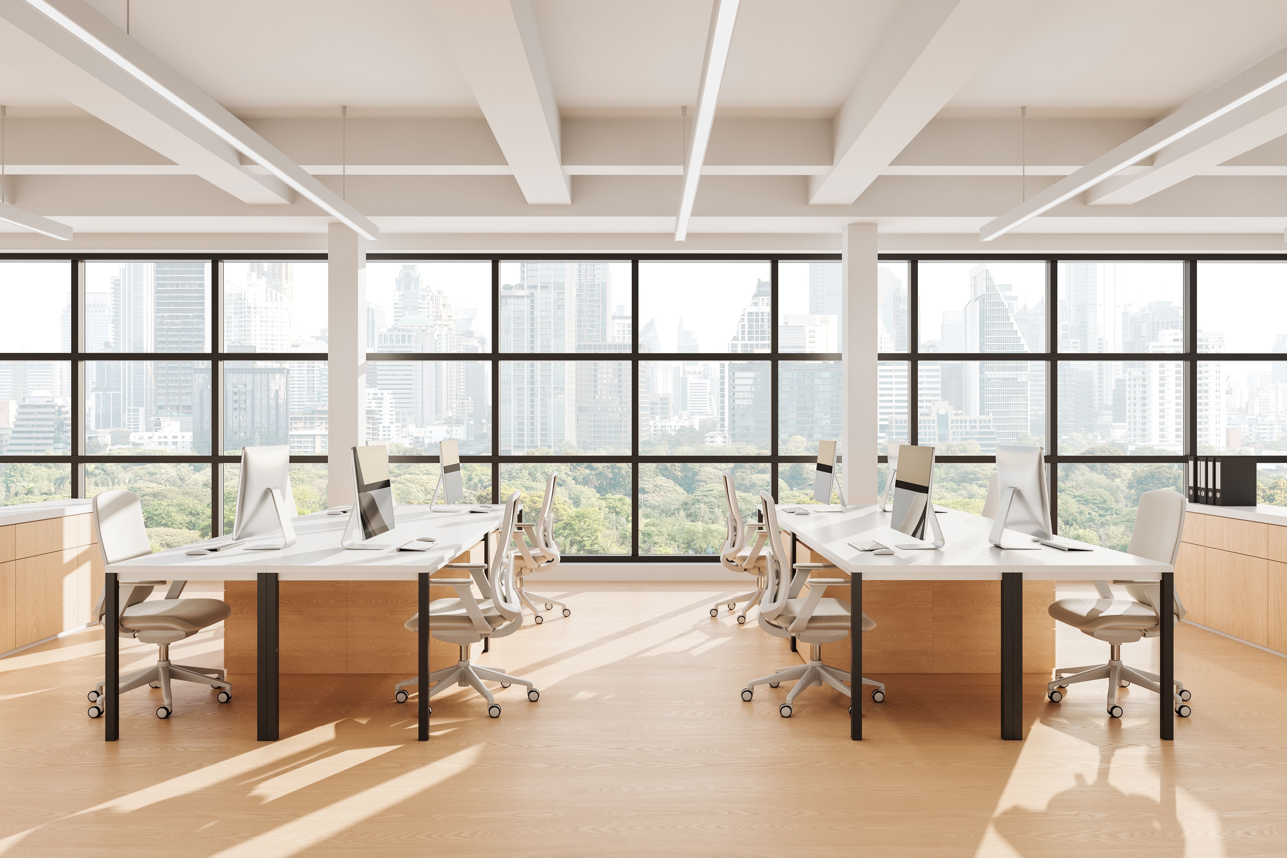 Modern open space office interior with minimalist design, large windows, white desks, and cityscape view in daylight. 3D Rendering. 3D Rendering