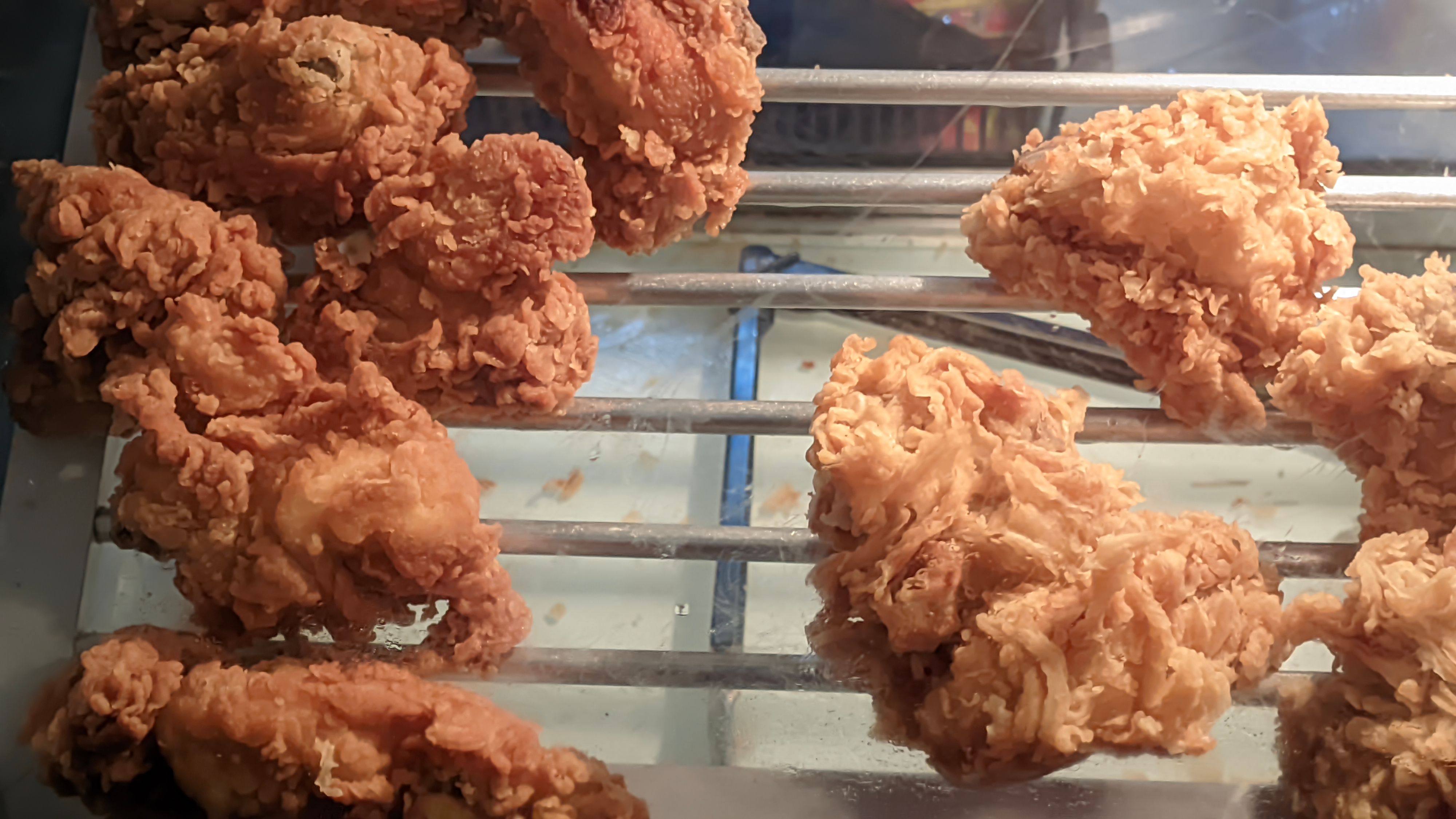 Kentucky fried chicken sold on display on a shelf Kentucky fried chicken sold on display on a shelf