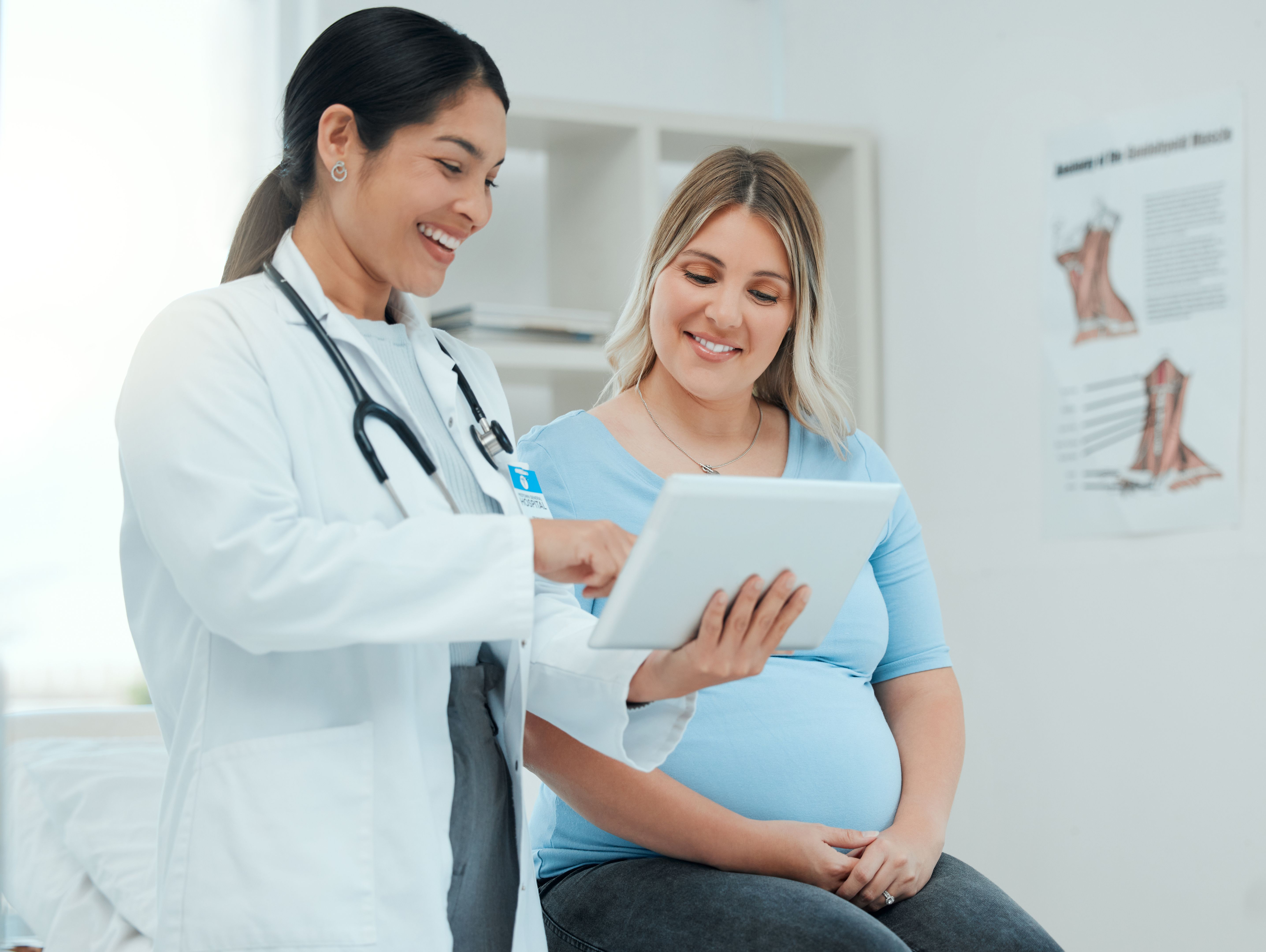 Shot of a doctor during a consultation with a pregnant patient in a clinic Shot of a doctor during a consultation with a pregnant patient in a clinic
