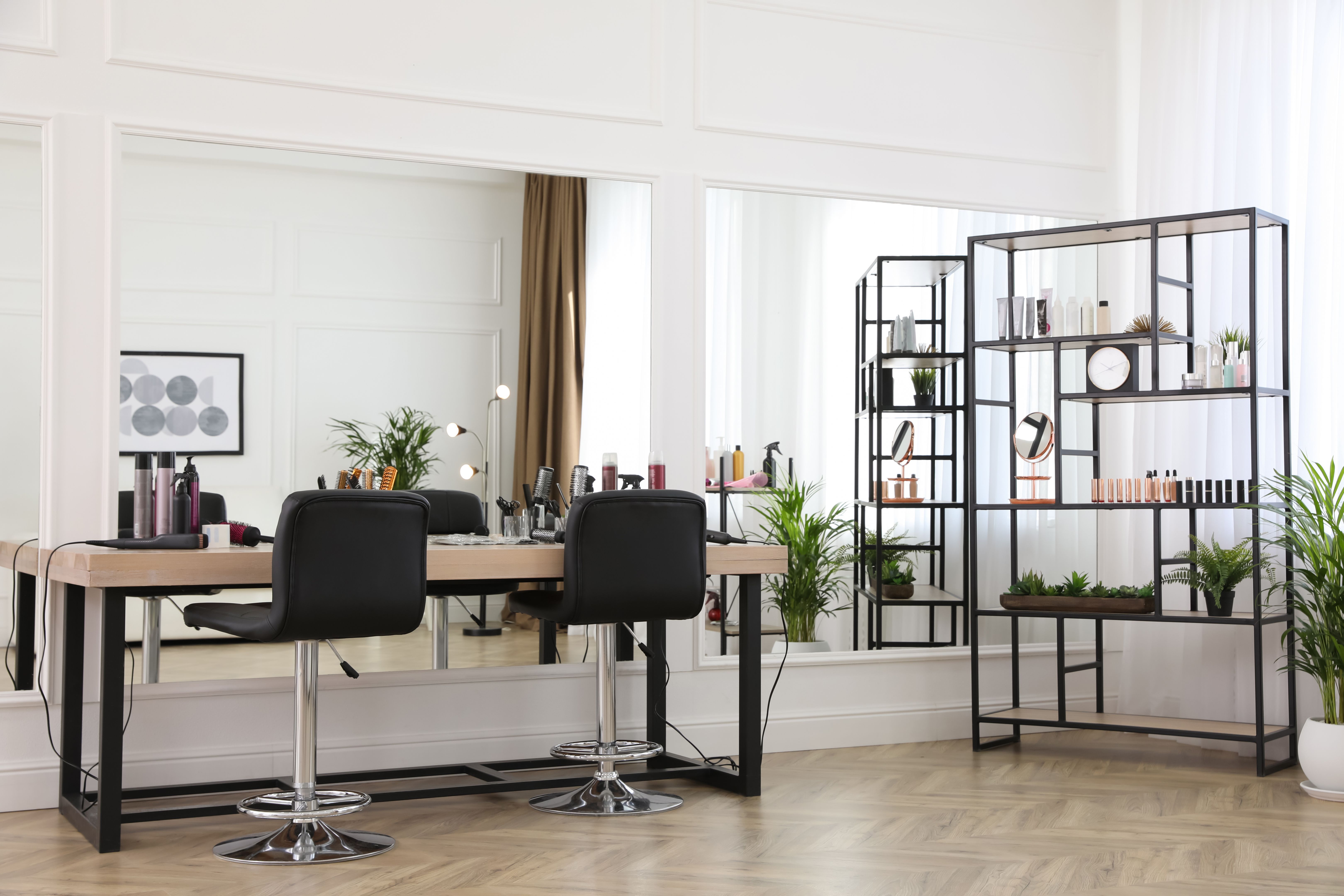 Stylish beauty salon interior with hairdresser's workplace