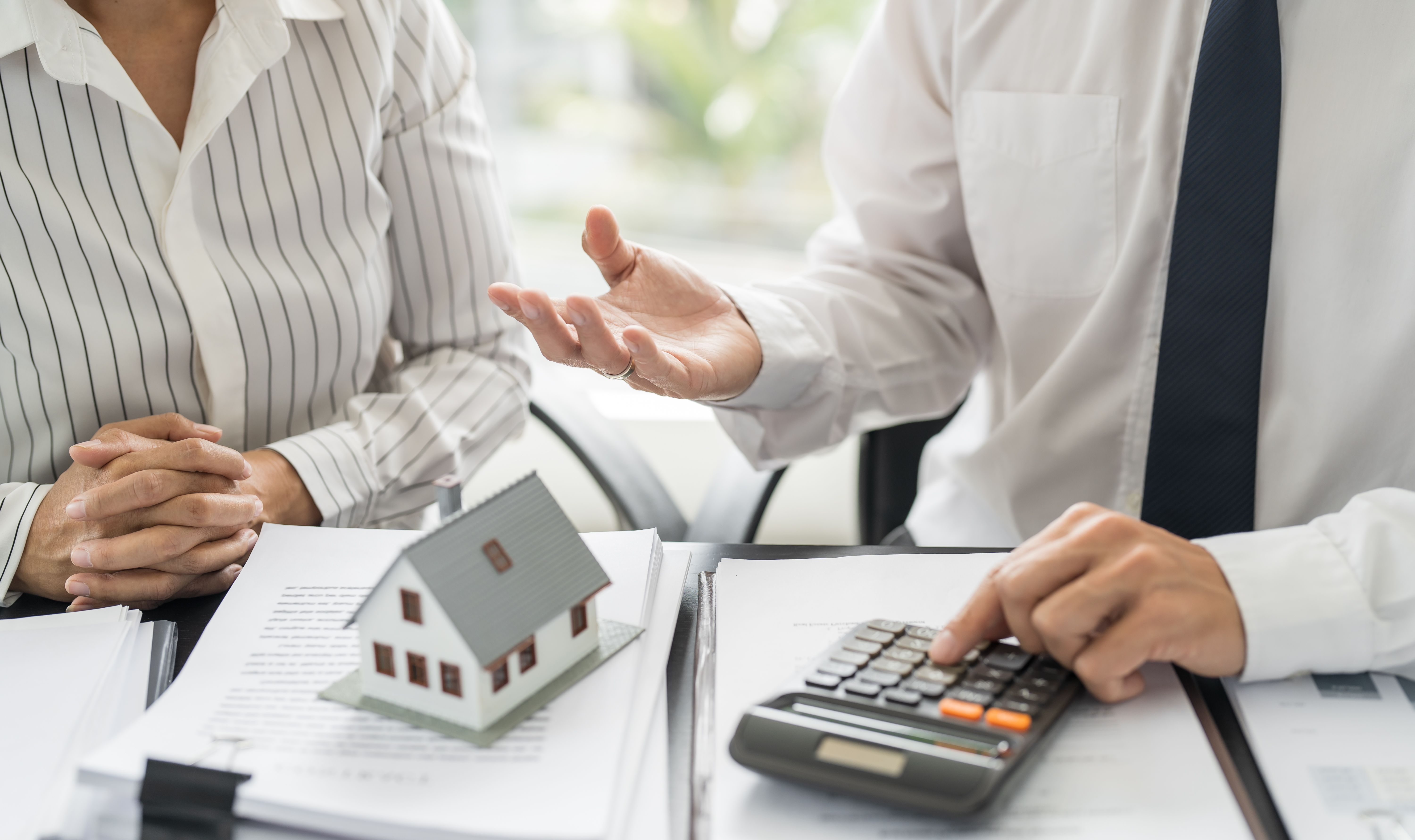 Business people signing contract making deal with real estate agent Concept for consultant home insuranceReal estate investment Property insurance security. Real estate agent