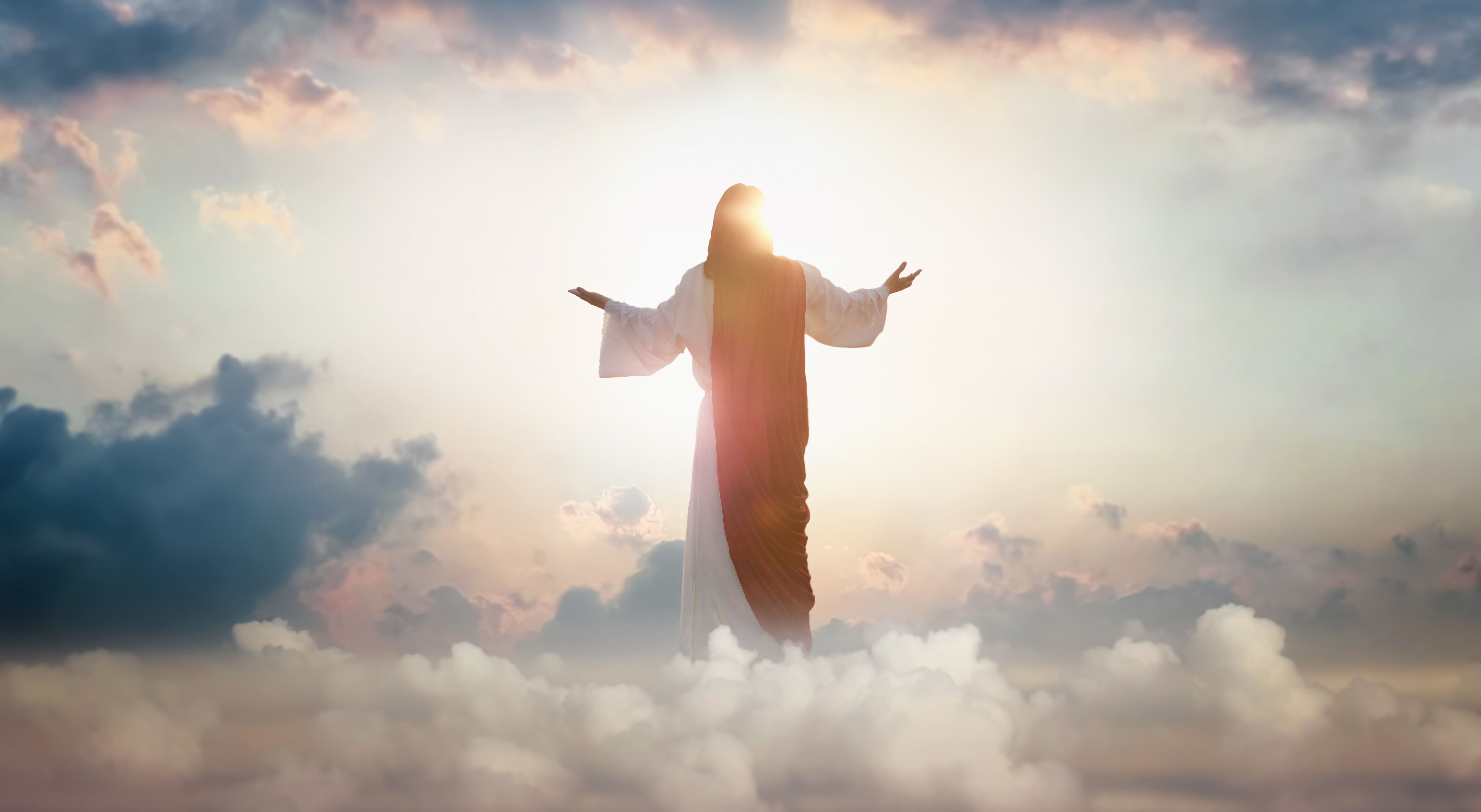 Resurrected Jesus Christ ascending above the sky and clouds, heaven concept Resurrected Jesus Christ ascending above the sky and clouds, heaven concept