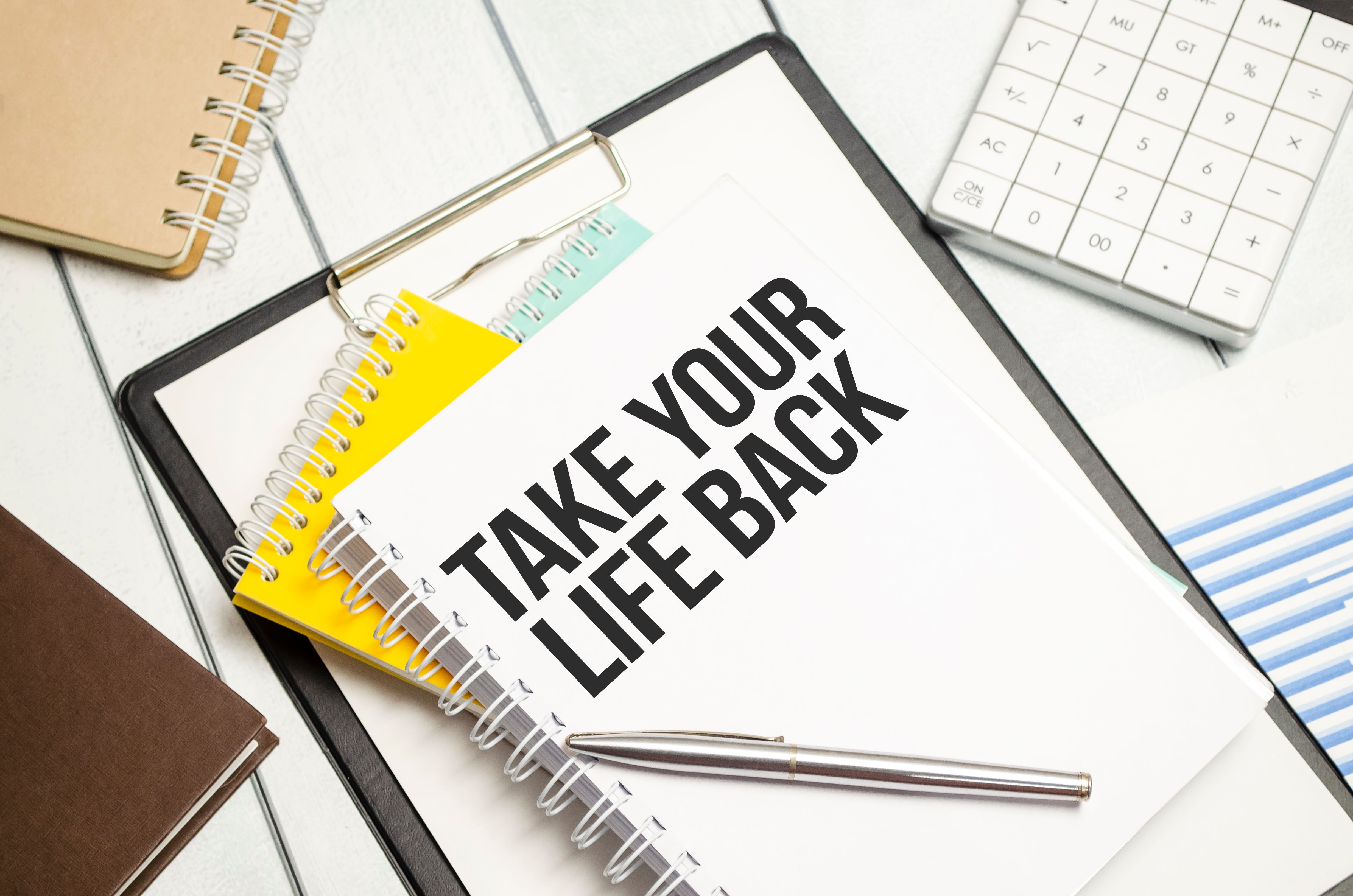 Take Your Life Back words on notebooks and charts Take Your Life Back words on notebooks and charts