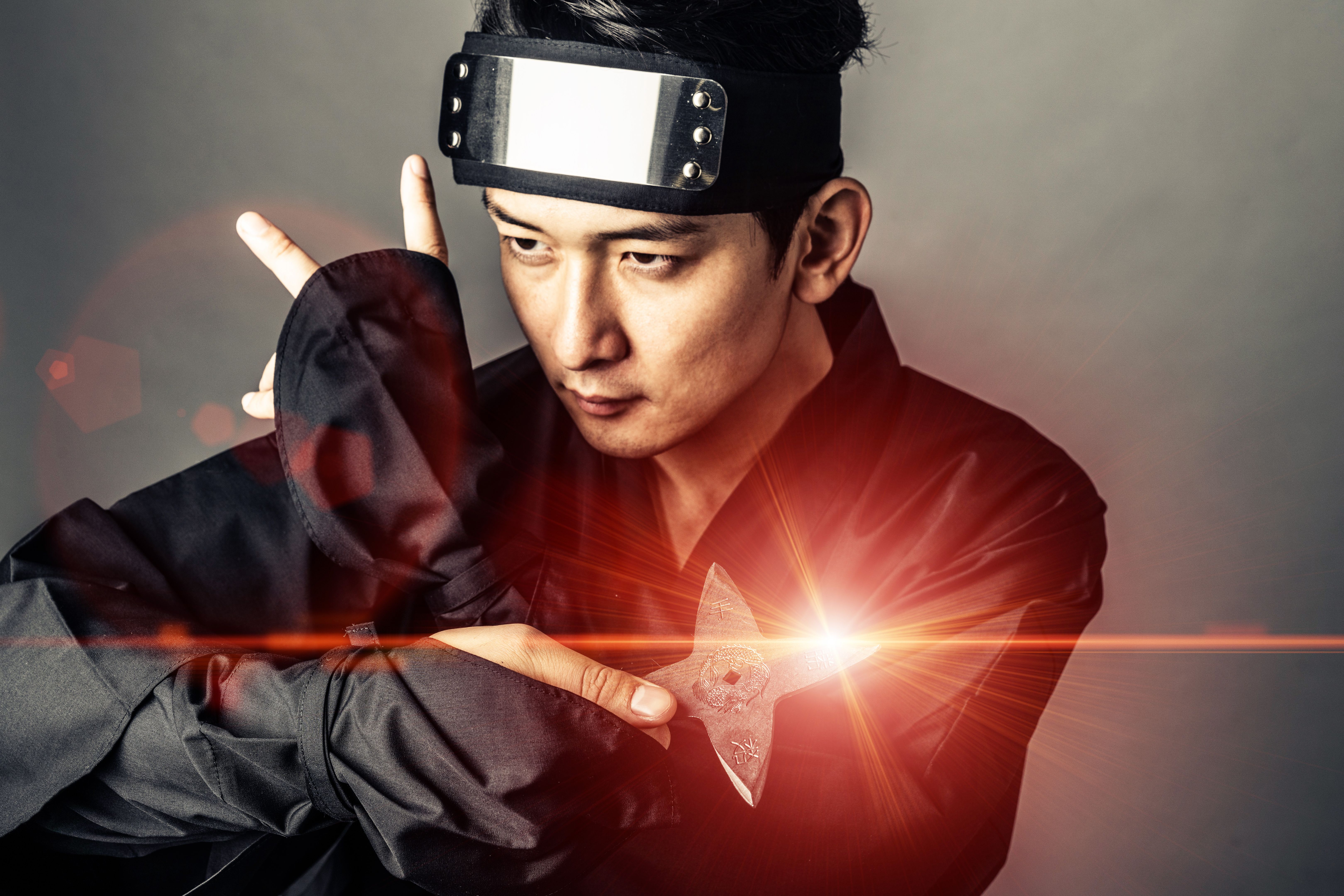 Japanese Ninja holding a shuriken. Samurai.