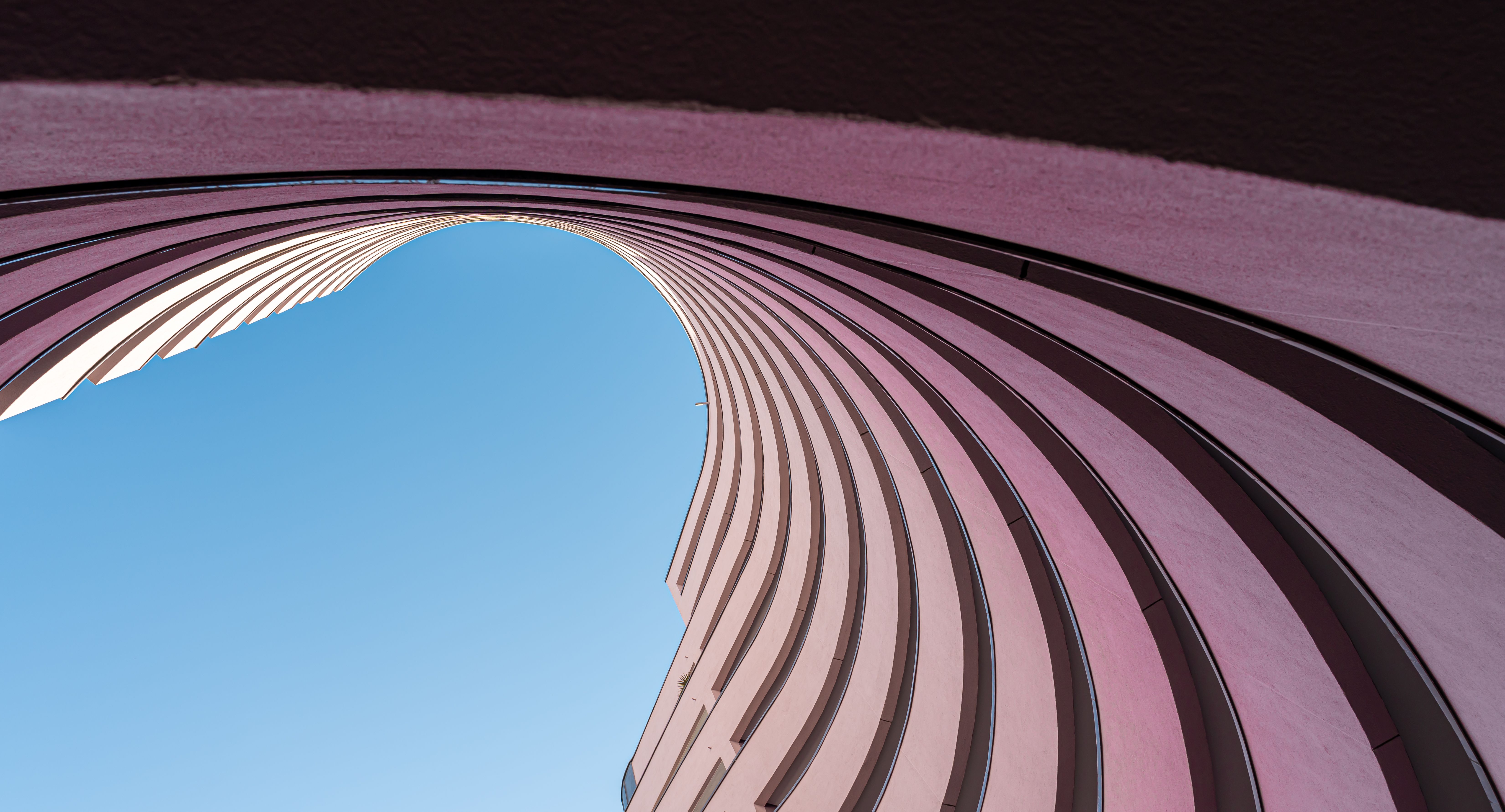 Modern apartment building against clear blue sky