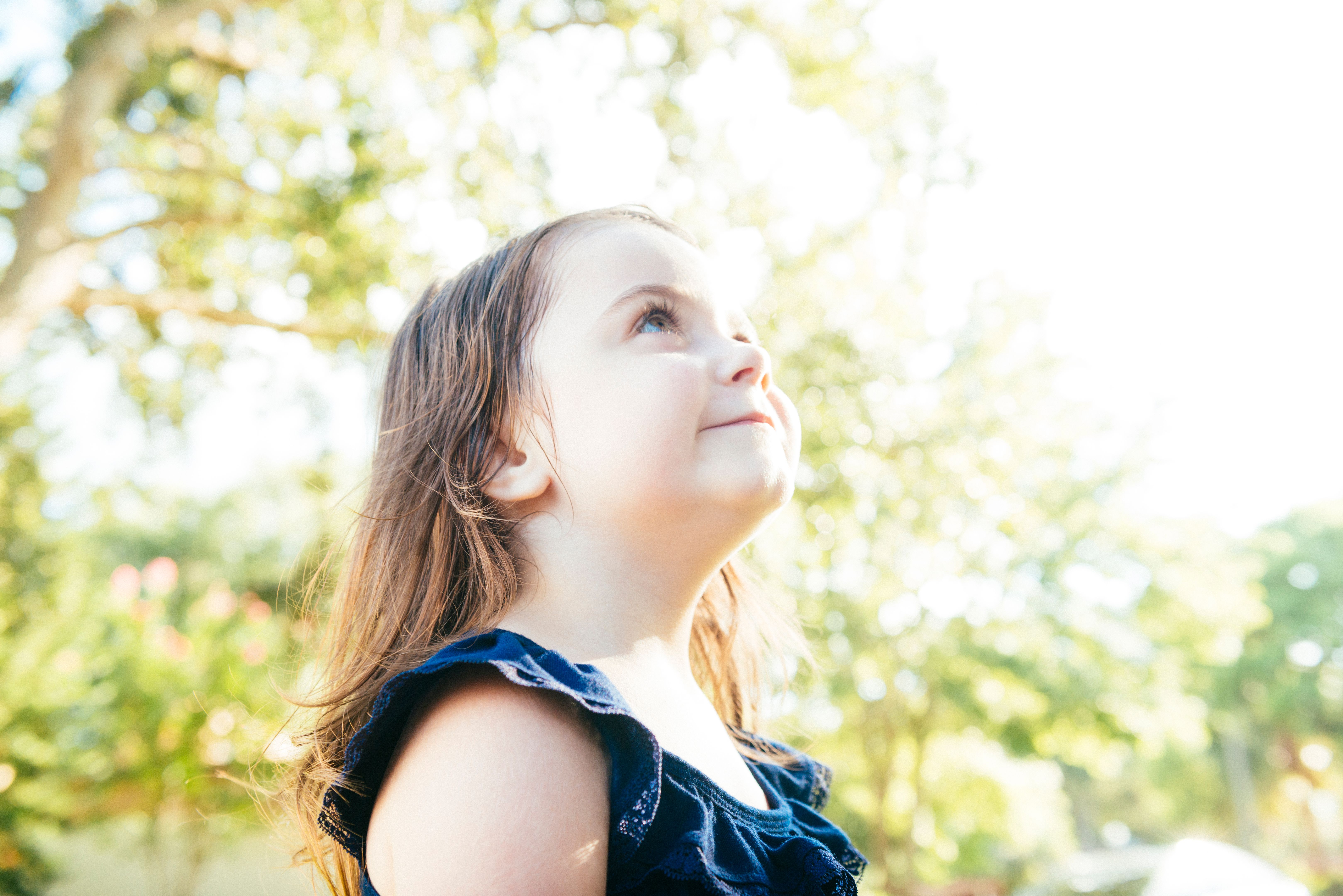 Face of Cute Little Girl Looking up with Angelic Face