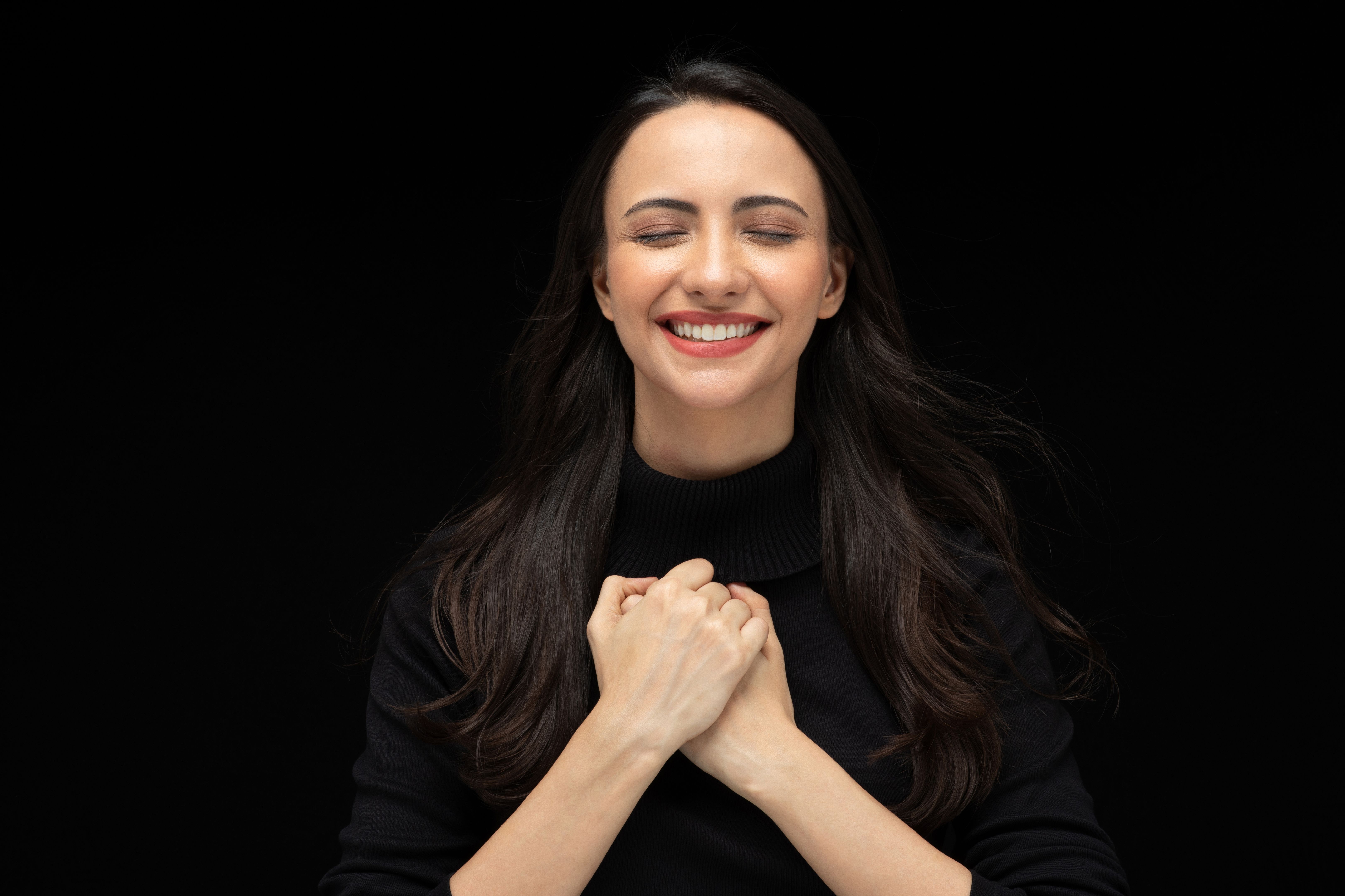 Photo of beautiful amazed girl wearing casual black t-shirt isolated black background stock photo Photo of beautiful amazed girl wearing casual black t-shirt isolated black background stock photo