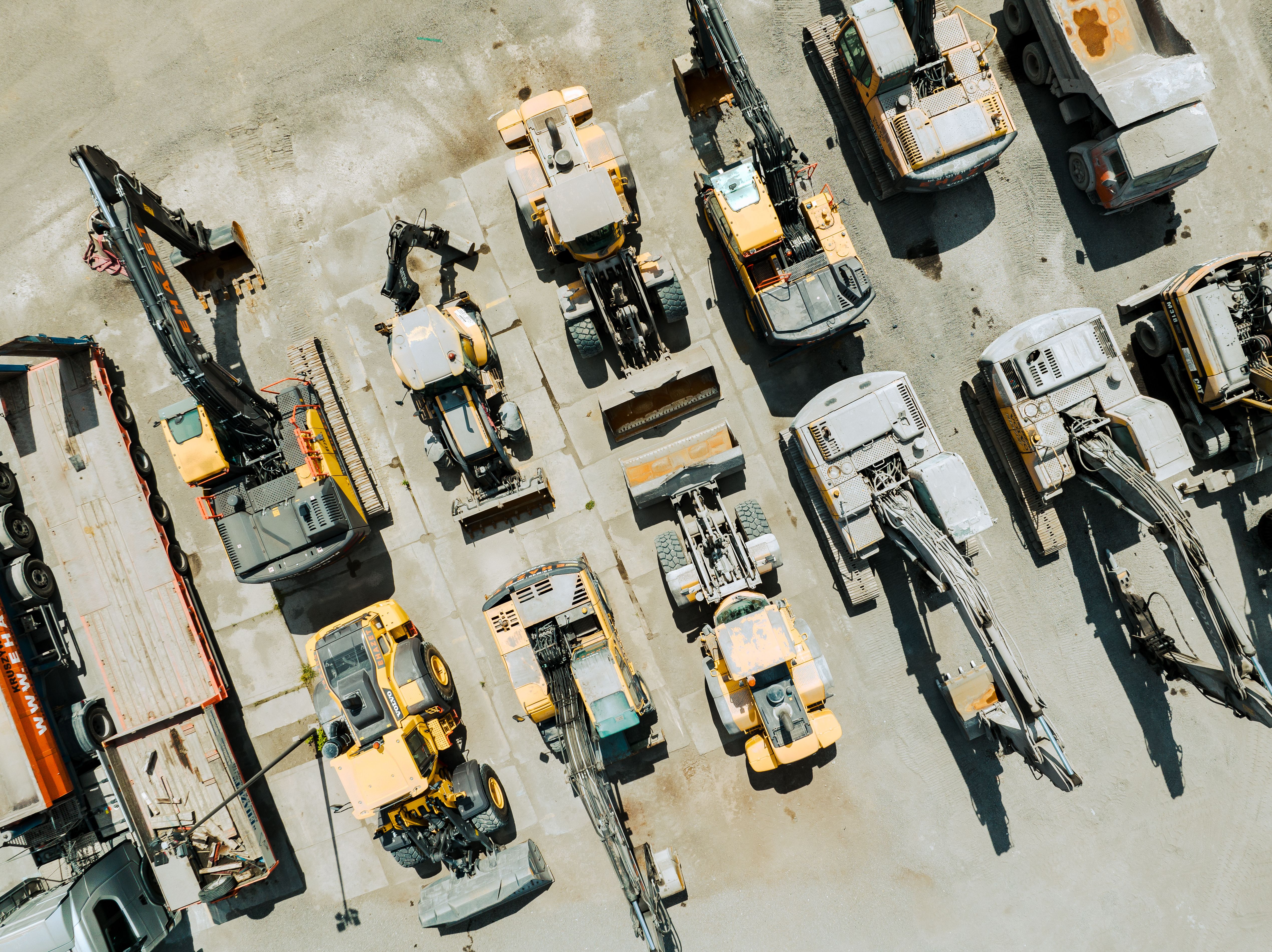 Aerial View of Industrial Equipment and Excavator on Industrial Place.