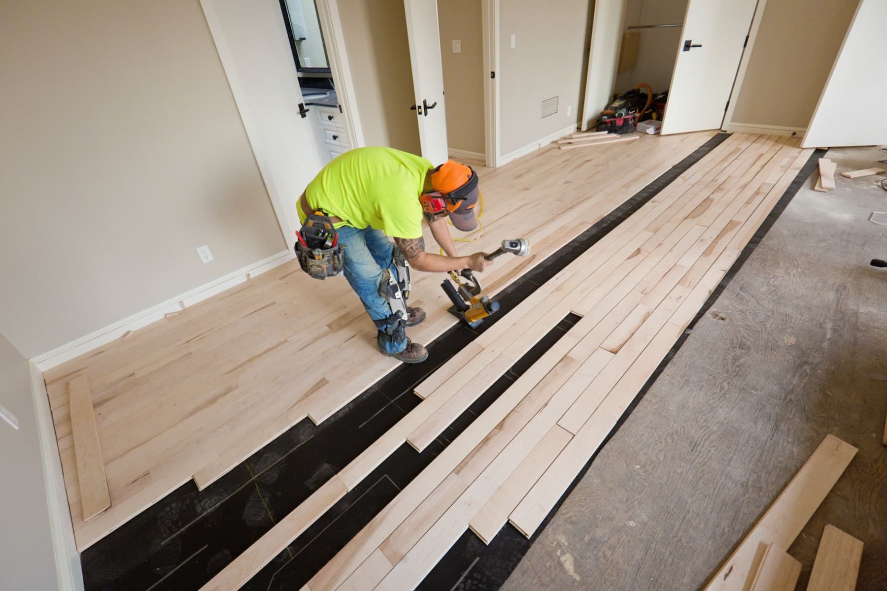Matt from Urban Edge installing hardwood flooring in a Cedar Rapids home