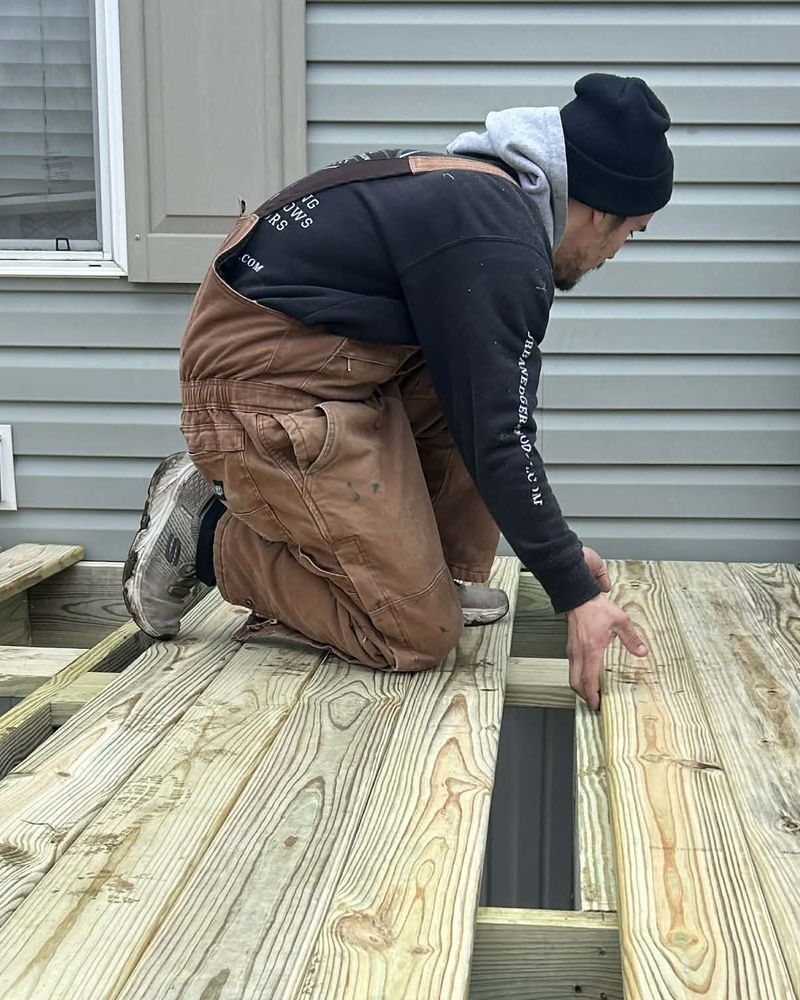 Matt, owner of Urban Edge Construction & Remodeling, installing new deck boards at a home in Cedar Rapids, Iowa