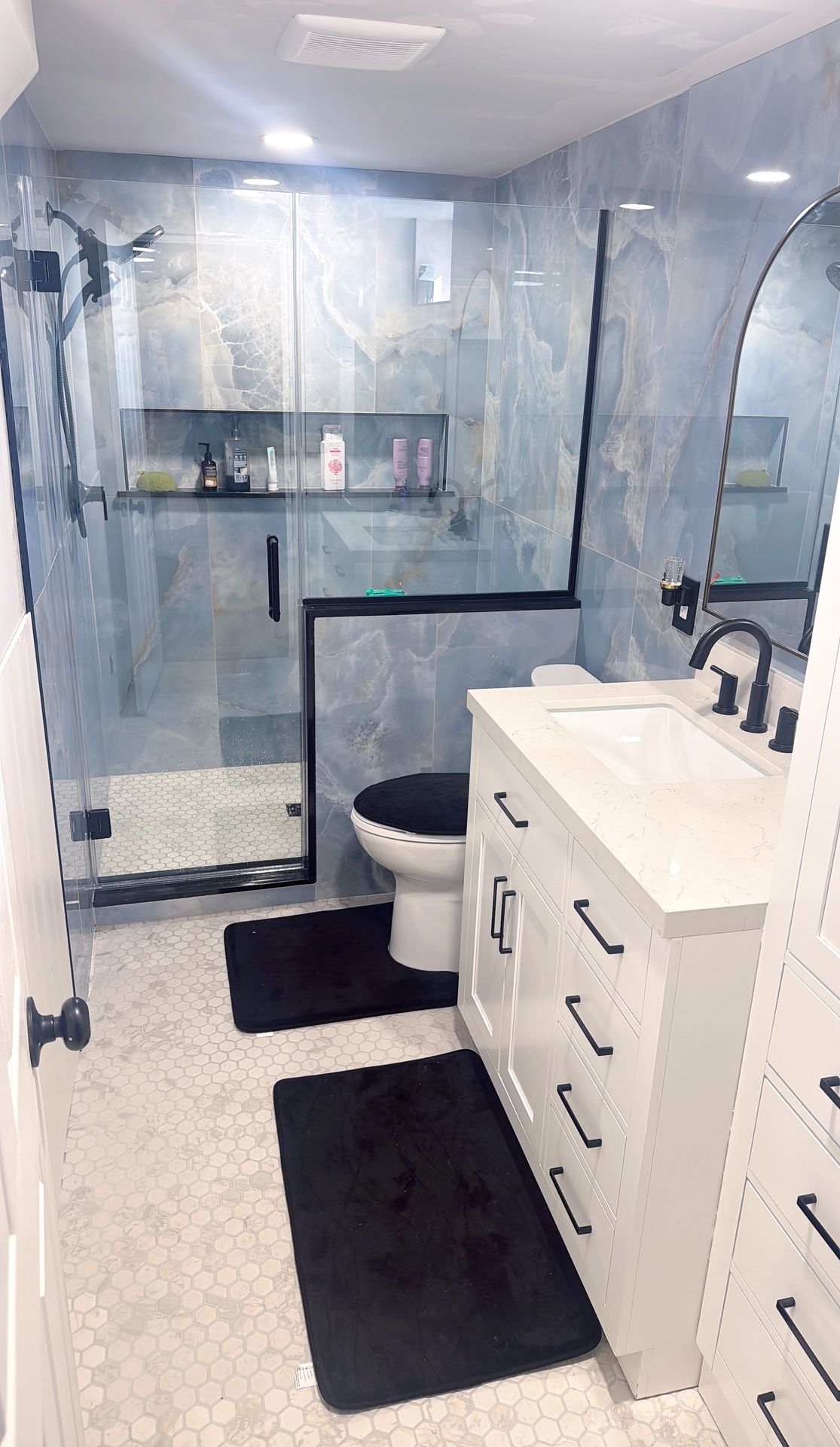 Second bathroom after remodel by Urban Edge Construction in Cedar Rapids, Iowa — updated finishes and fixtures