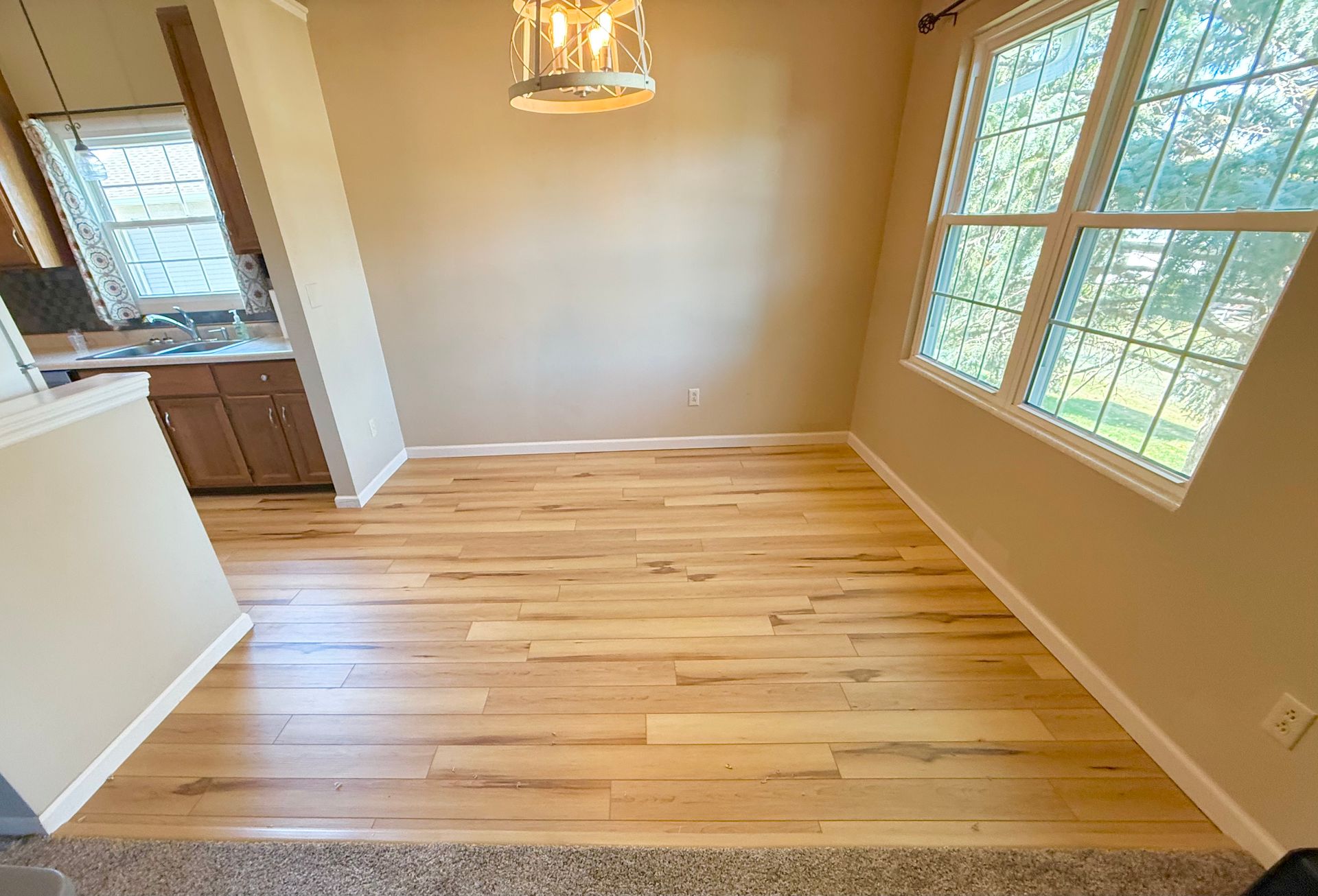Natural hardwood flooring installed in a Cedar Rapids dining room