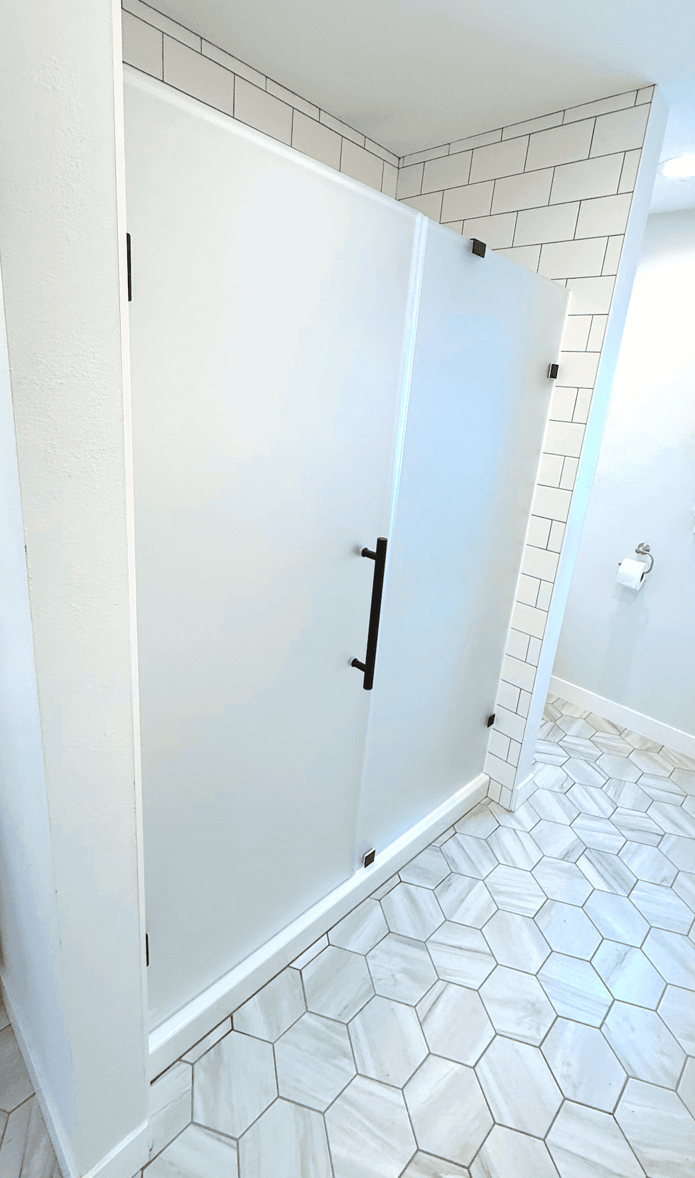 Bathroom remodel by Urban Edge Construction in Cedar Rapids, Iowa — custom tile and updated finishes