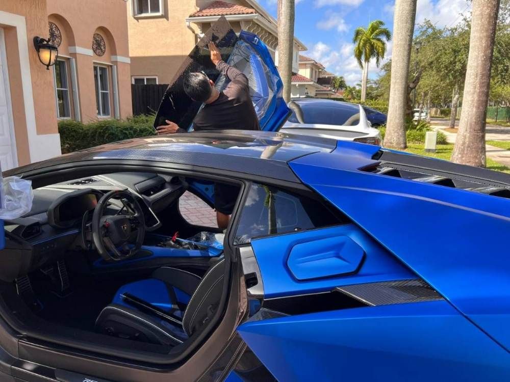 mobile window tinting Coral Gables FL ceramic tint installation luxury car heat rejection UV protection Miami Auto Tinting