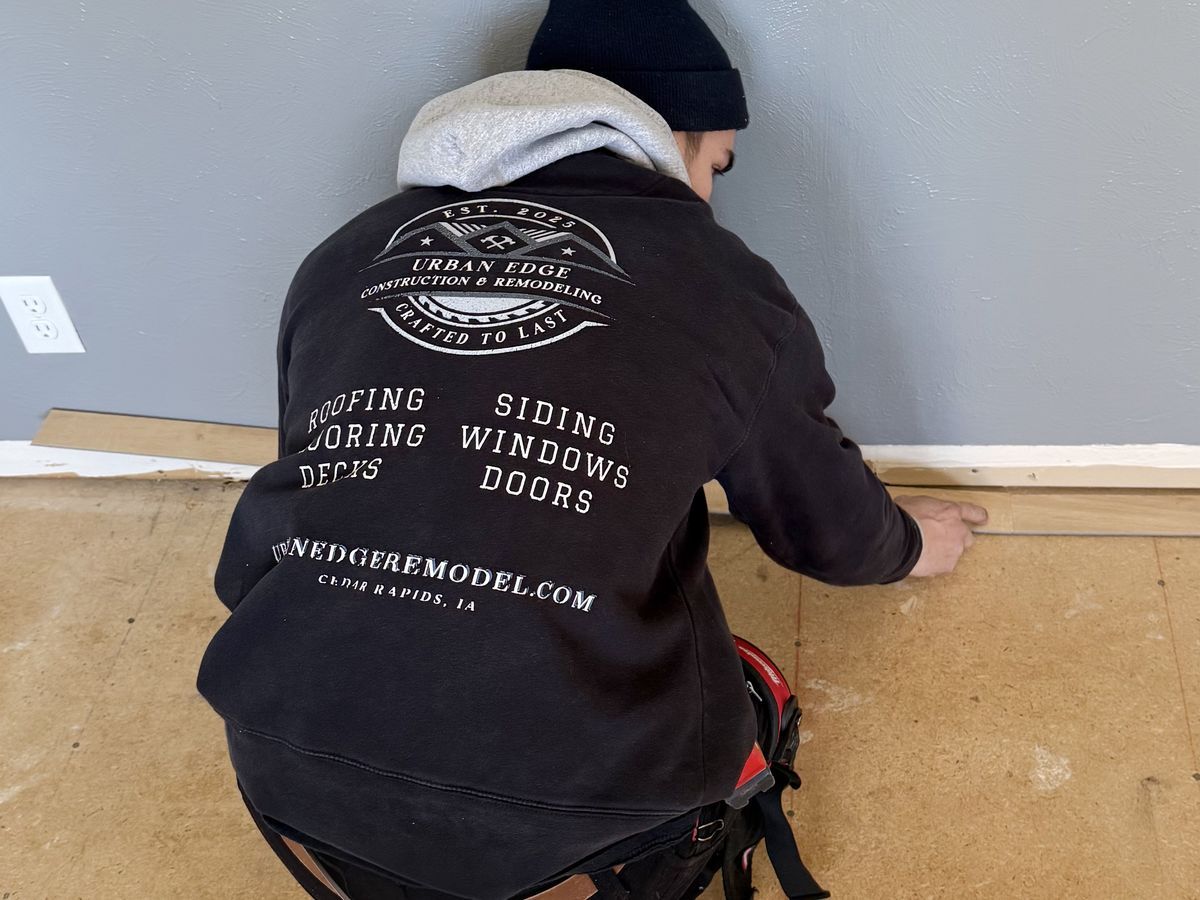 Matt installing flooring in a Cedar Rapids home