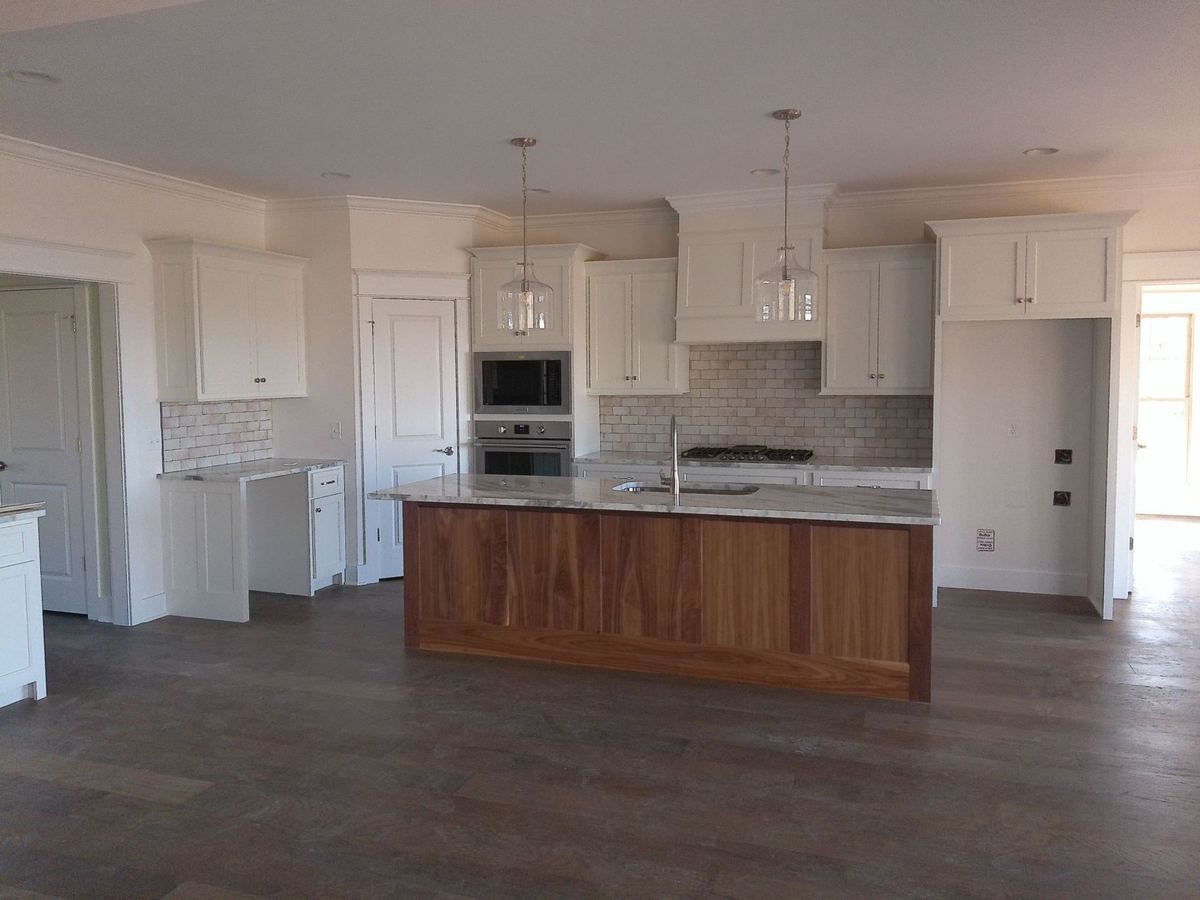 Completed kitchen remodel by Urban Edge Construction in Cedar Rapids, Iowa — cabinets, countertops, and flooring