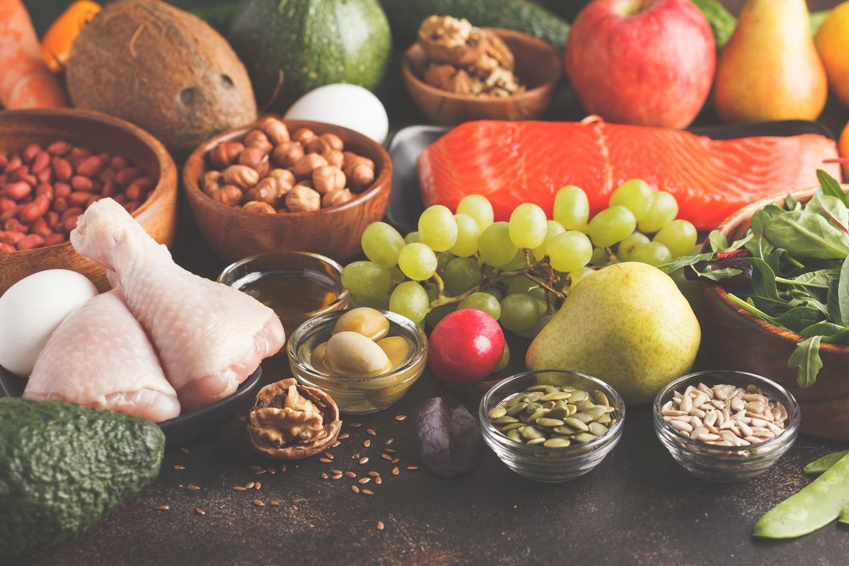 Paleo diet concept. Balanced food background on the table.  Copy space, dark background.