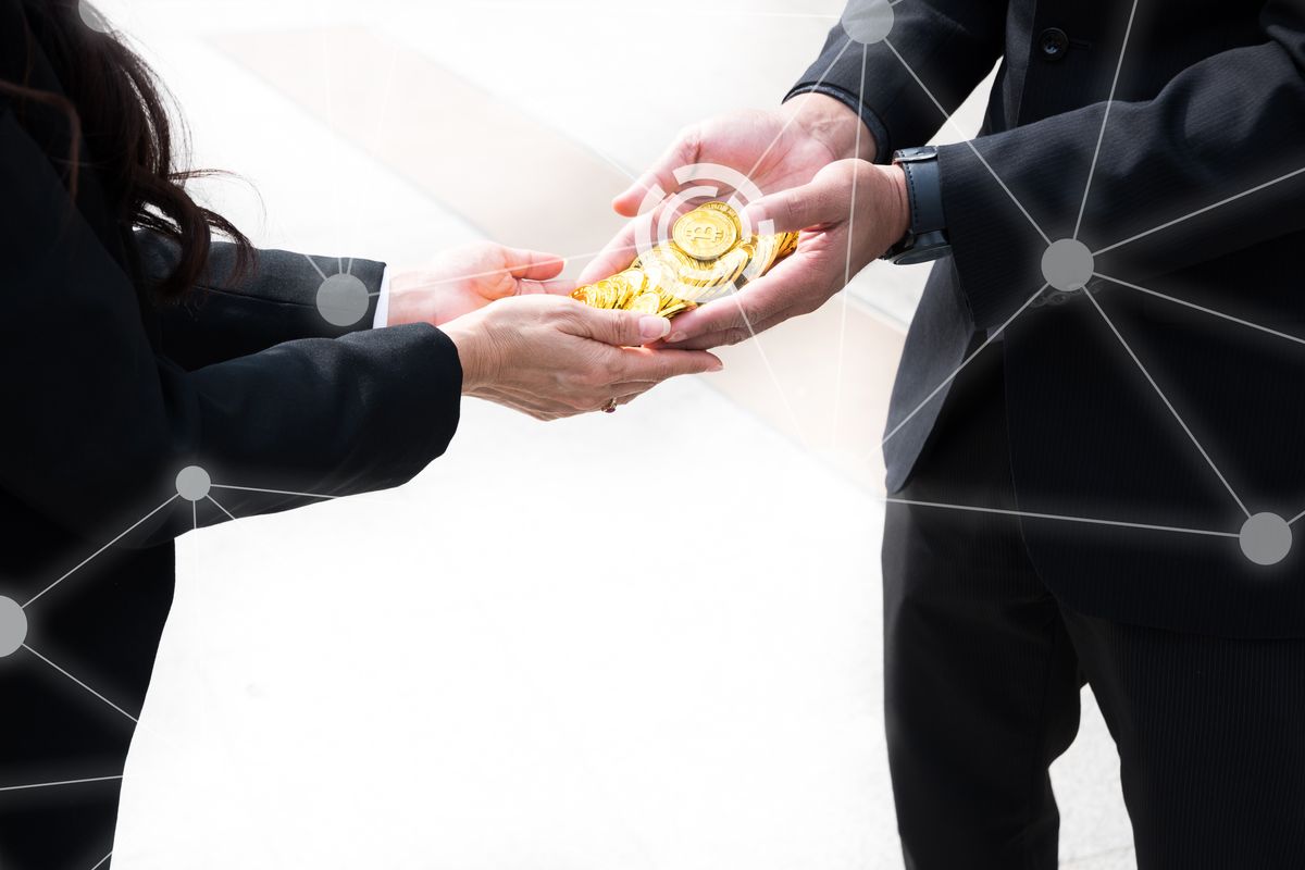 War of bitcoin, Businessman giving bitcoin hand to hand businesswoman. Digital currency with graphic and white background.