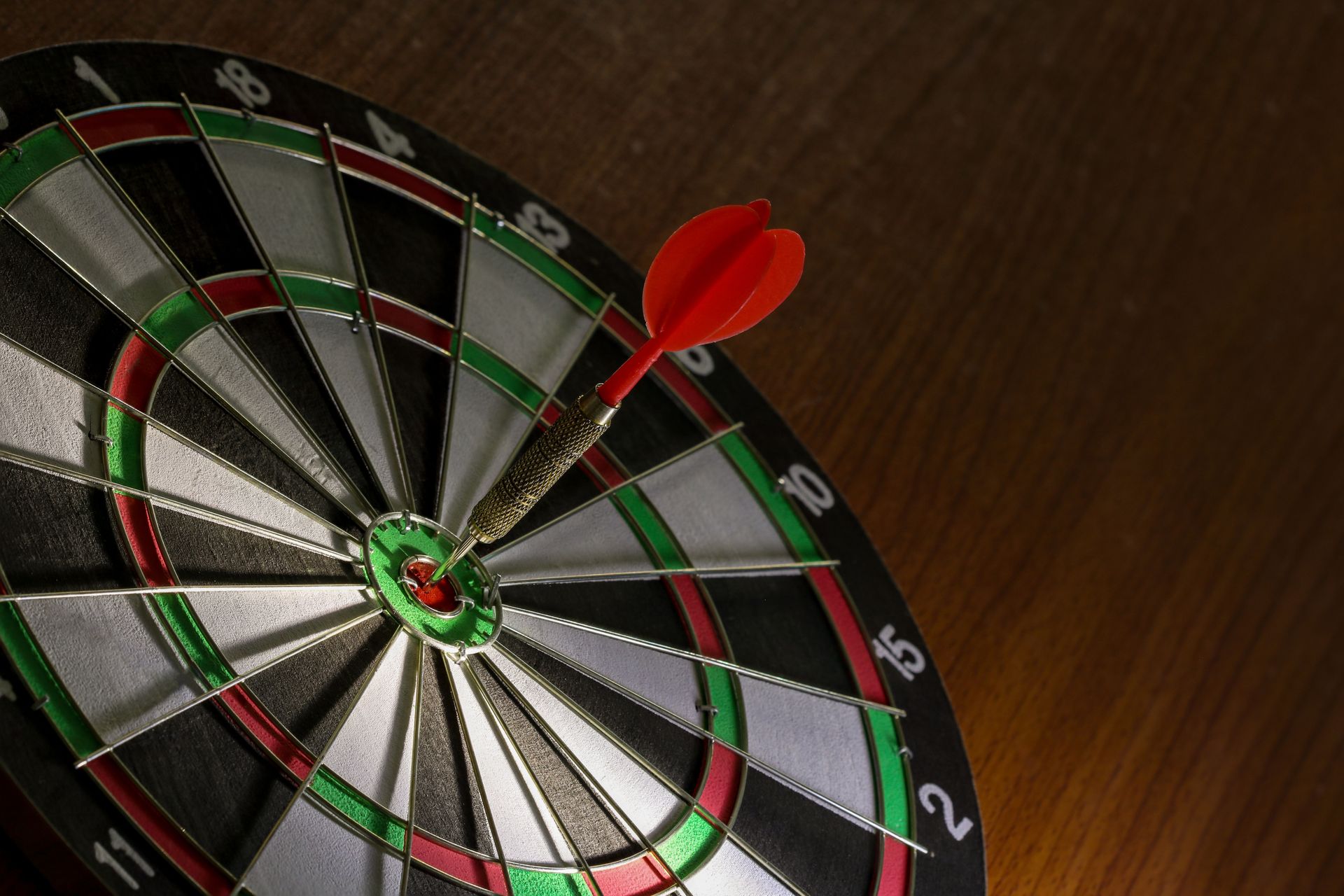 Red Dart hitting center Target, Right on target concept using dart in the bulls eye on dartboard business success concept fierce competition on stillife tone, Red Dart hitting center Target, Right on target concept using dart in the bulls eye on dartboard business success concept fierce competition on stillife tone,